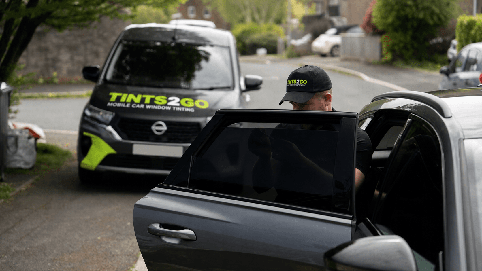 Tints2go mobile tinting vehicle with green brand remake
