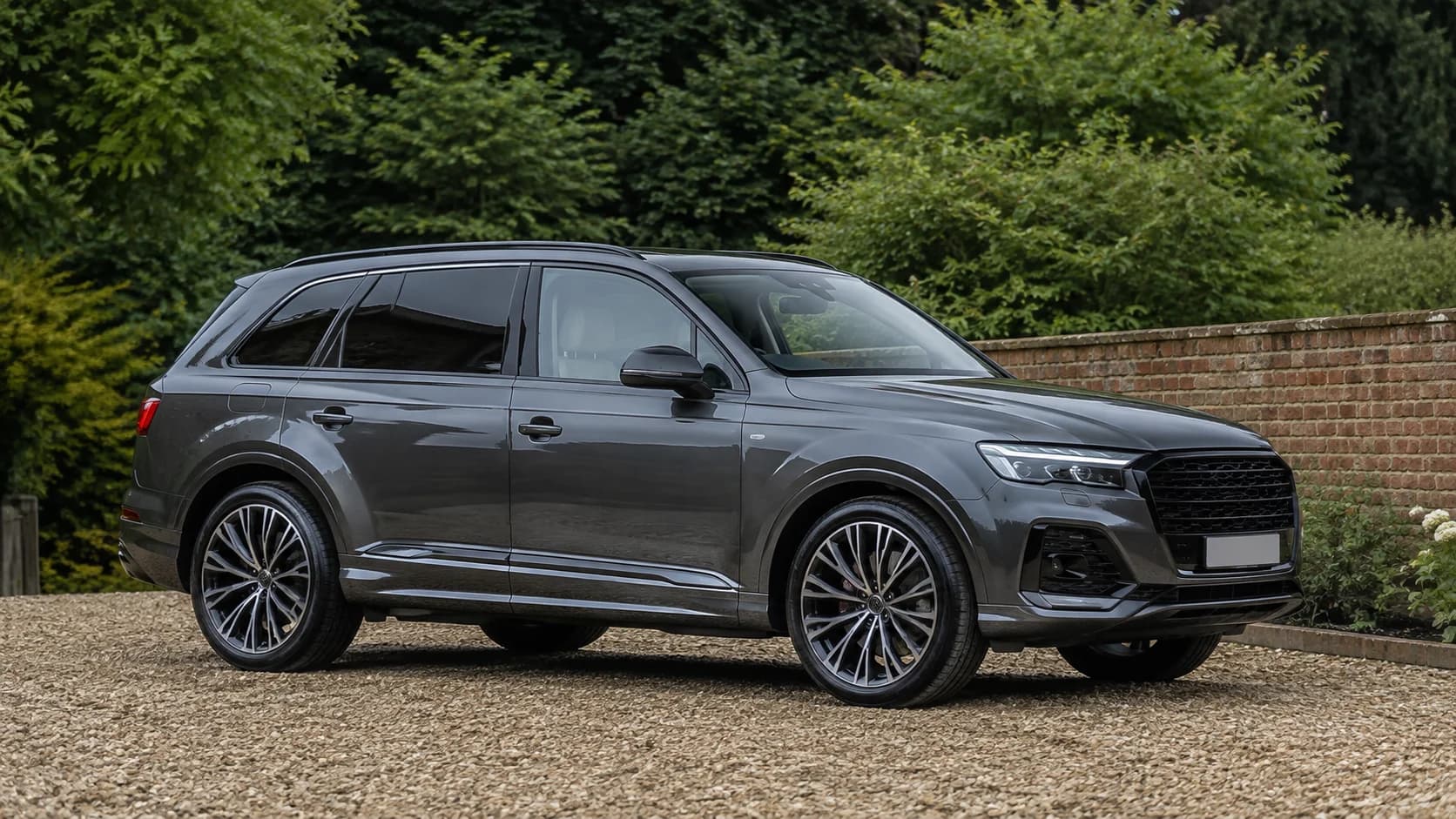 Graphite SUV illustrating dark rear window tint and lighter front glazing