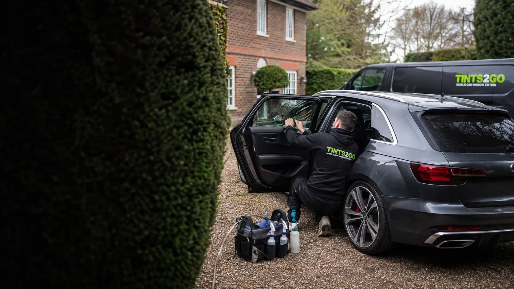 Illustrative Tints2Go mobile window tinting appointment on a UK driveway