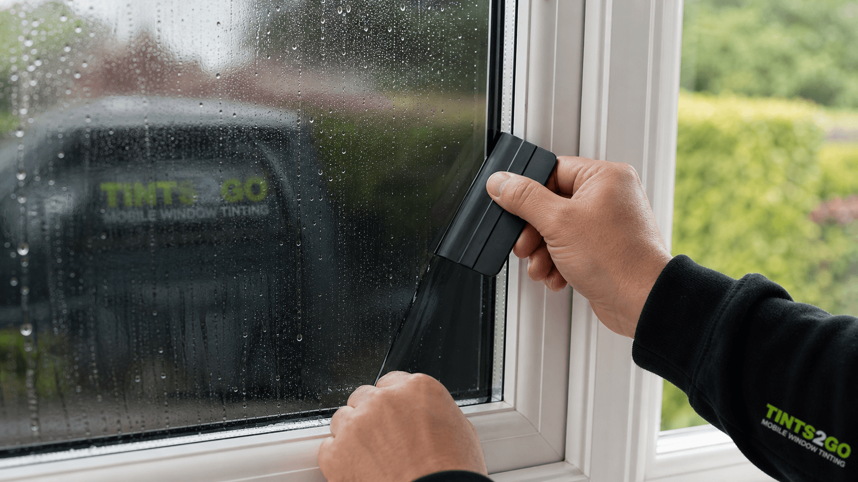 Tints2go branded residential window film installation scene
